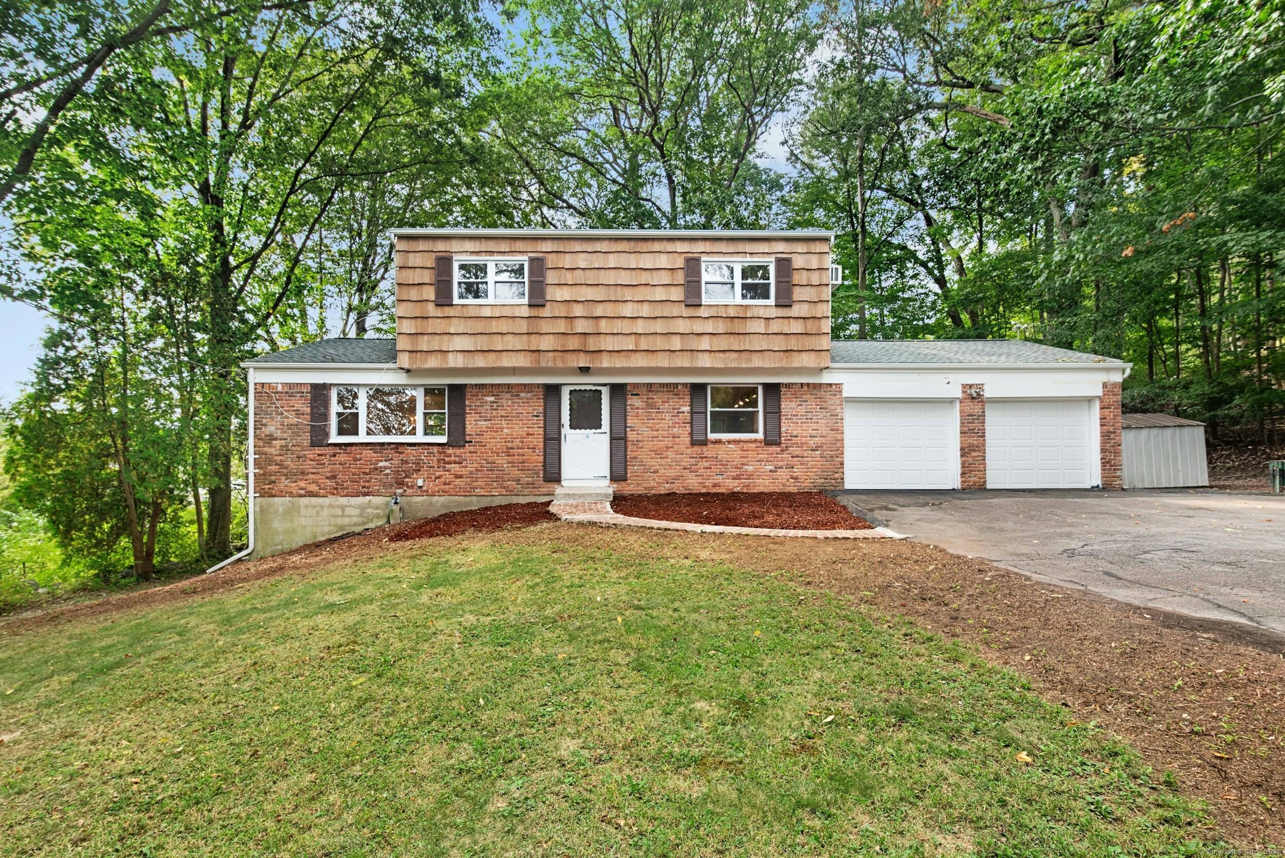 Welcome to this classic 3 bedroom Colonial tucked at the end of a quiet cul de sac in one of Stamford's most convenient neighborhoods.