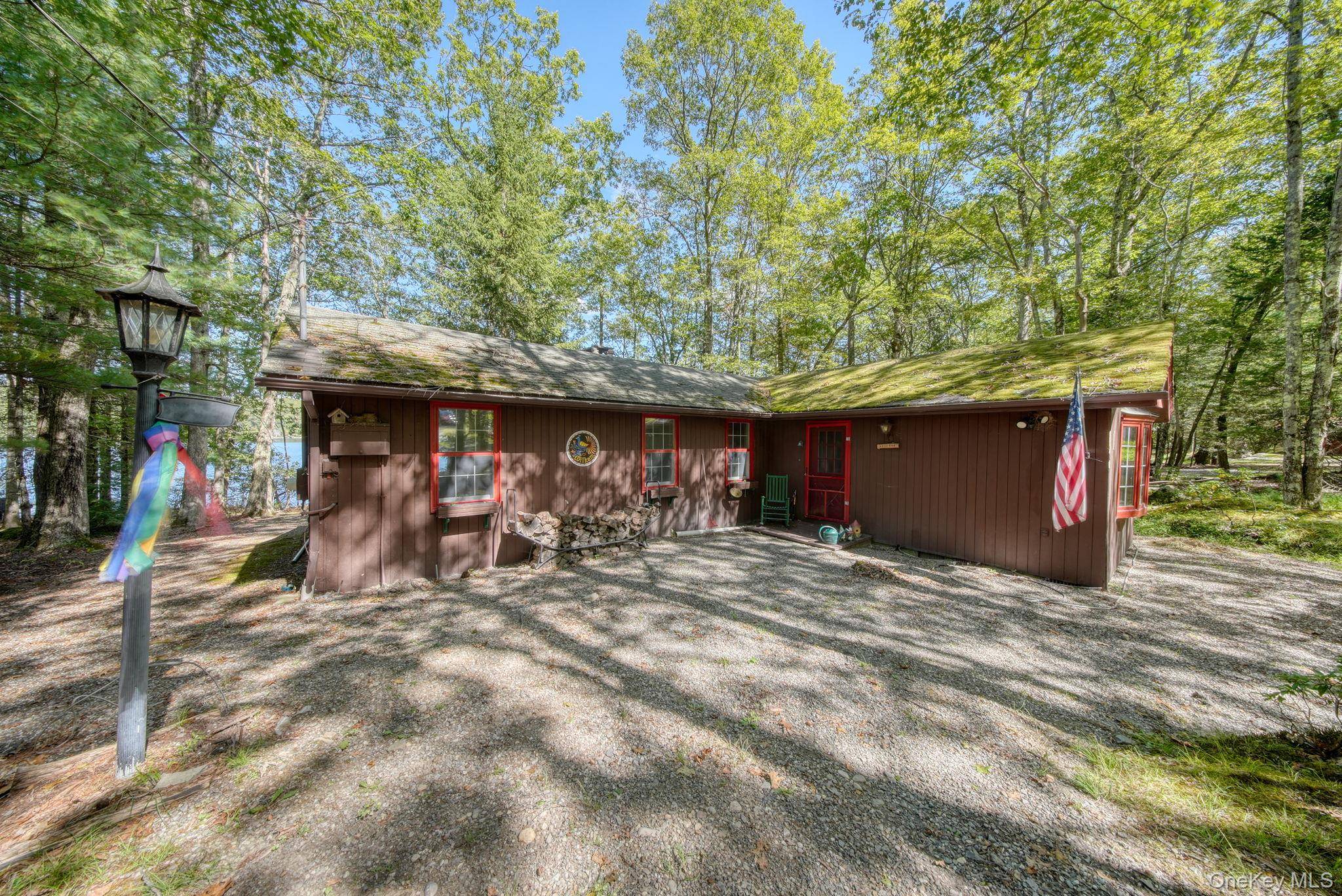 Welcome to your charming lakefront retreat nestled in the desirable Wolf Lake community.