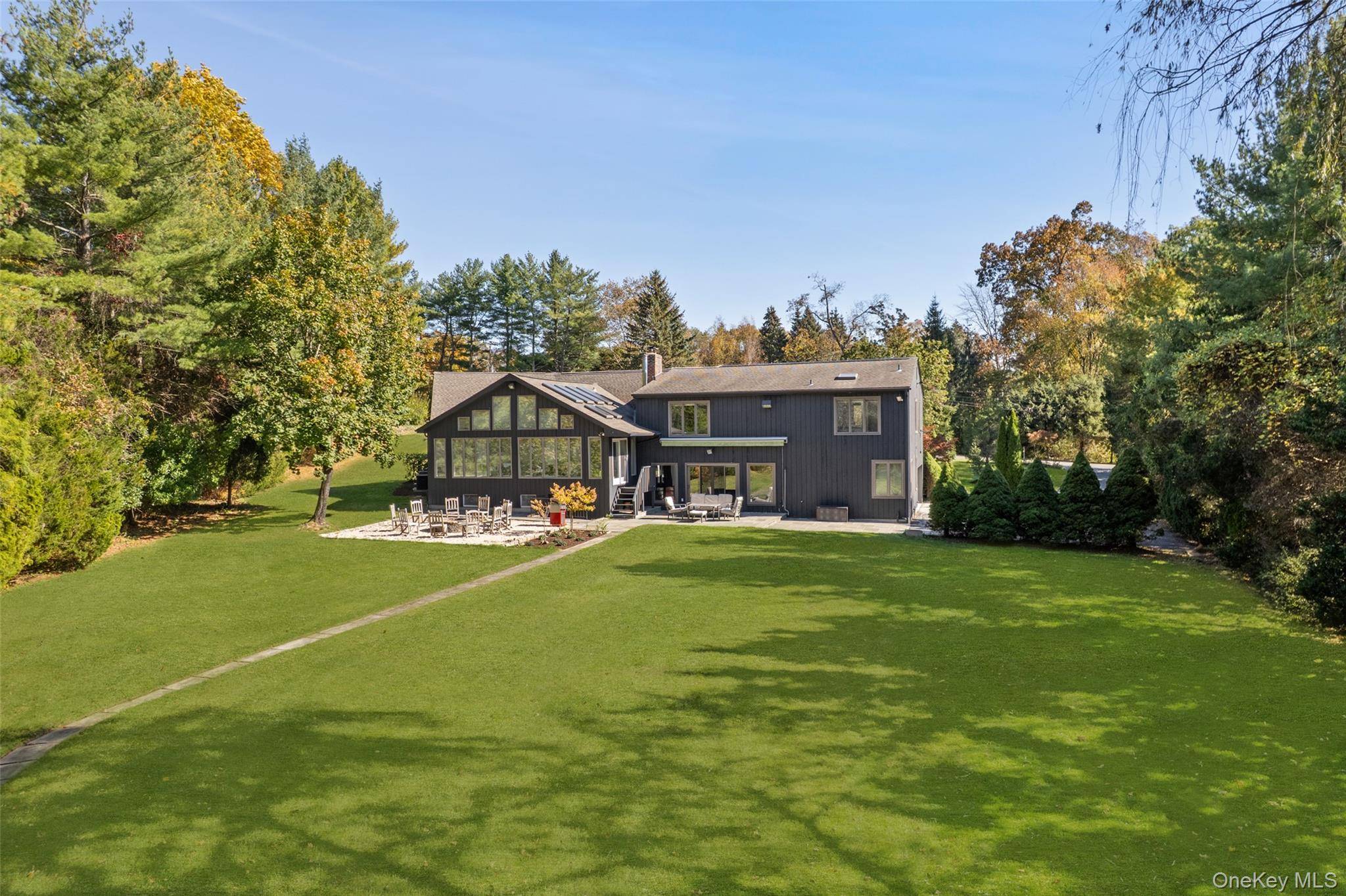Experience the ultimate blend of luxury and convenience in this stunning contemporary home, perfectly situated on over an acre of prime flat land in Purchase, New York just 45 minutes ...