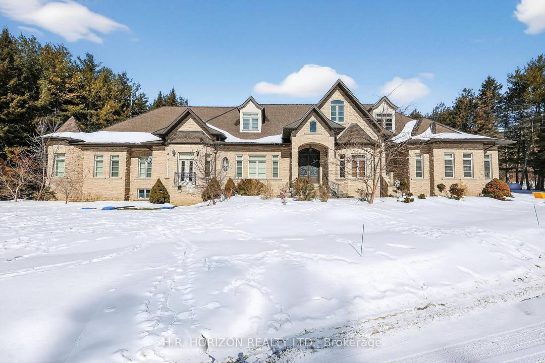 Welcome to an extraordinary private estate set on 11 breathtaking acres in the heart of prestigious King Township.