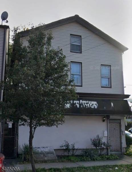 Mixed use property located on a high traffic corner along Summer Street, surrounded by established businesses.