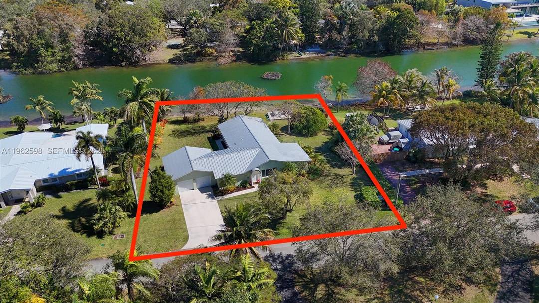 Custom built in 2010, this stunning lakefront property offers gorgeous panoramas from its 18, 329 square foot lot in the heart of Pinecrest.