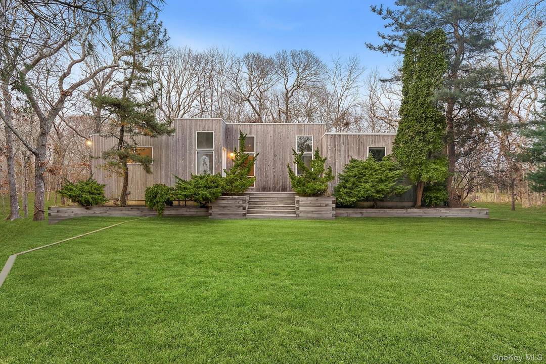 Away from the hustle and bustle but close to all the Hamptons have to offer sits this private contemporary.