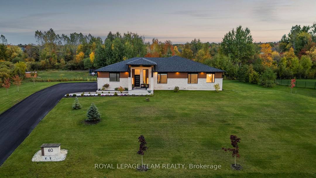 This custom built luxury bungalow offers over 5600 sq ft of total finished living space, set on a rare estate sized lot of over 2 acres in an upscale, low ...