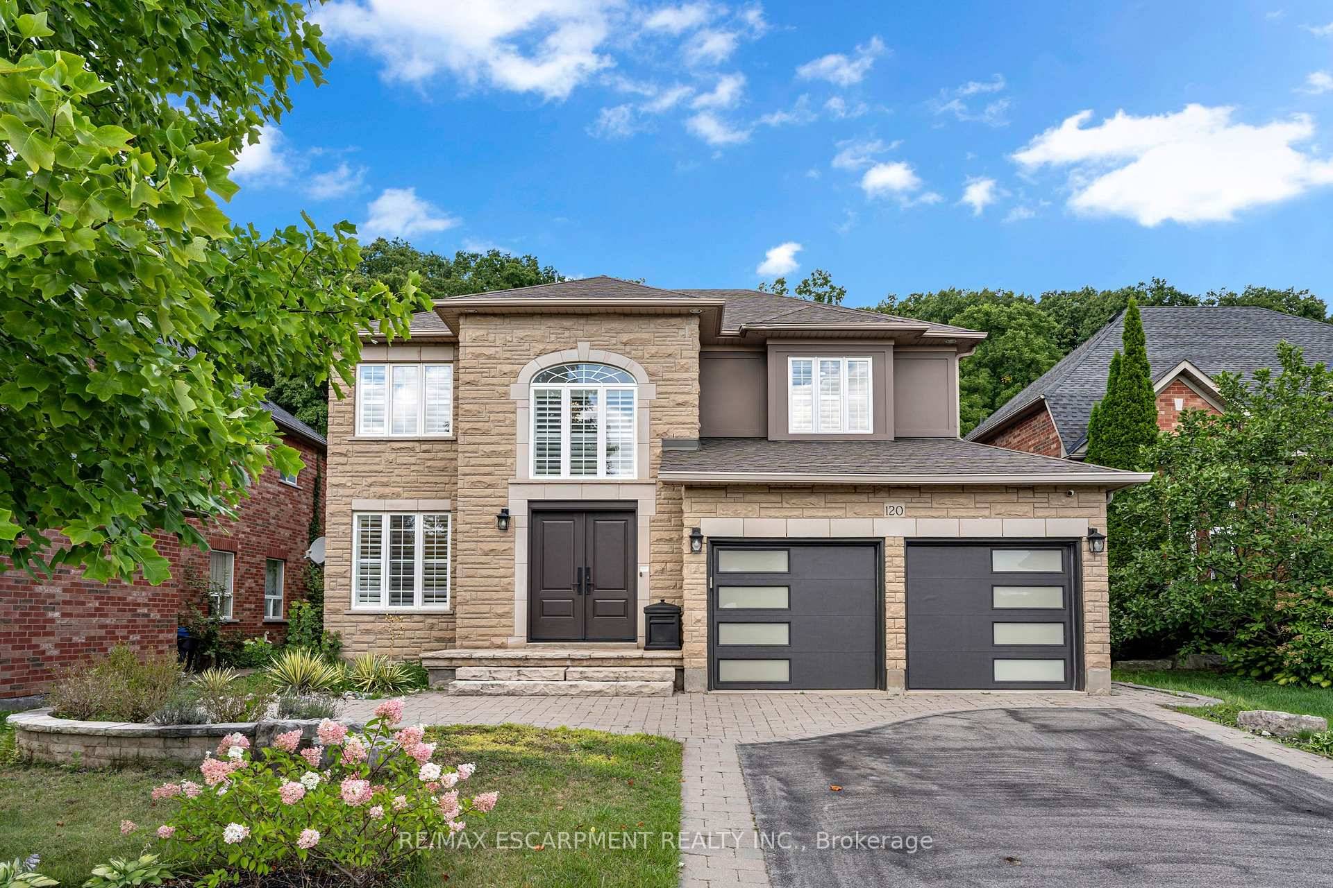 Nestled on a quiet street in one of Dundas most desirable neighbourhoods, this impressive 5 2 bedroom plus multiple dens, 5.
