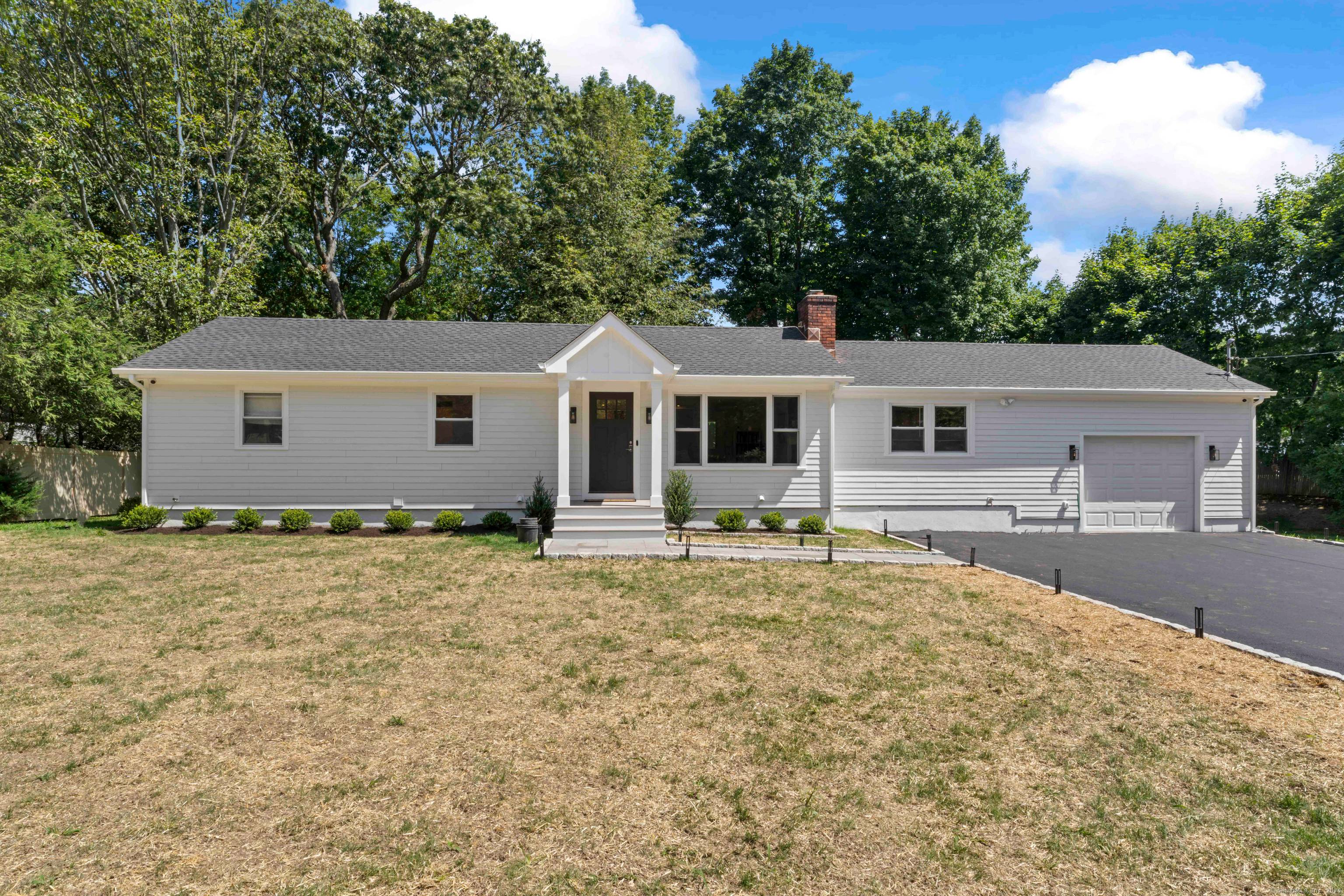 Welcome to a refined Elegance Nestled at the end of a cul de sac in Norwalk, the Village of Rowayton.