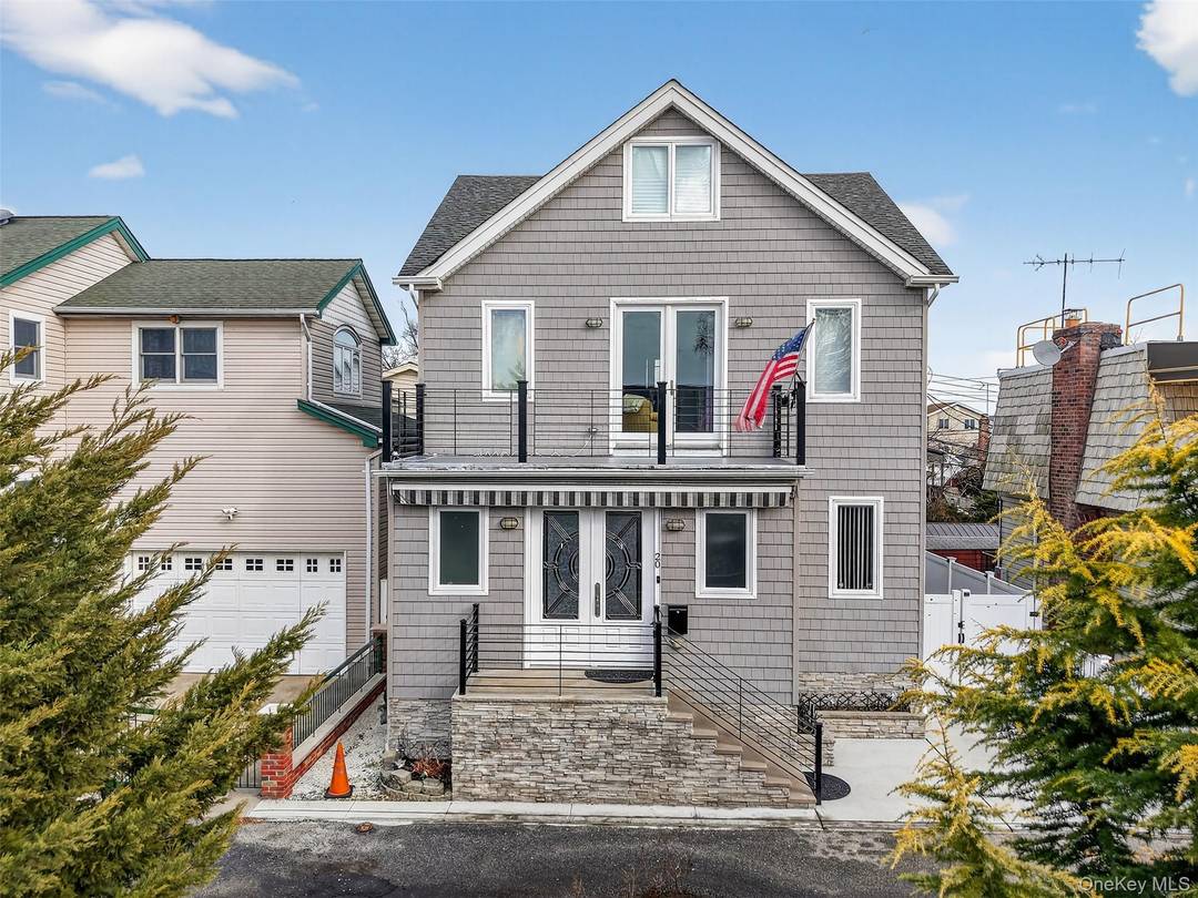 Exceptional custom built, coastal colonial situated on a rare front to back double lot 20 Hyman Ct 23 Gain Ct, offering space, privacy, and versatility.