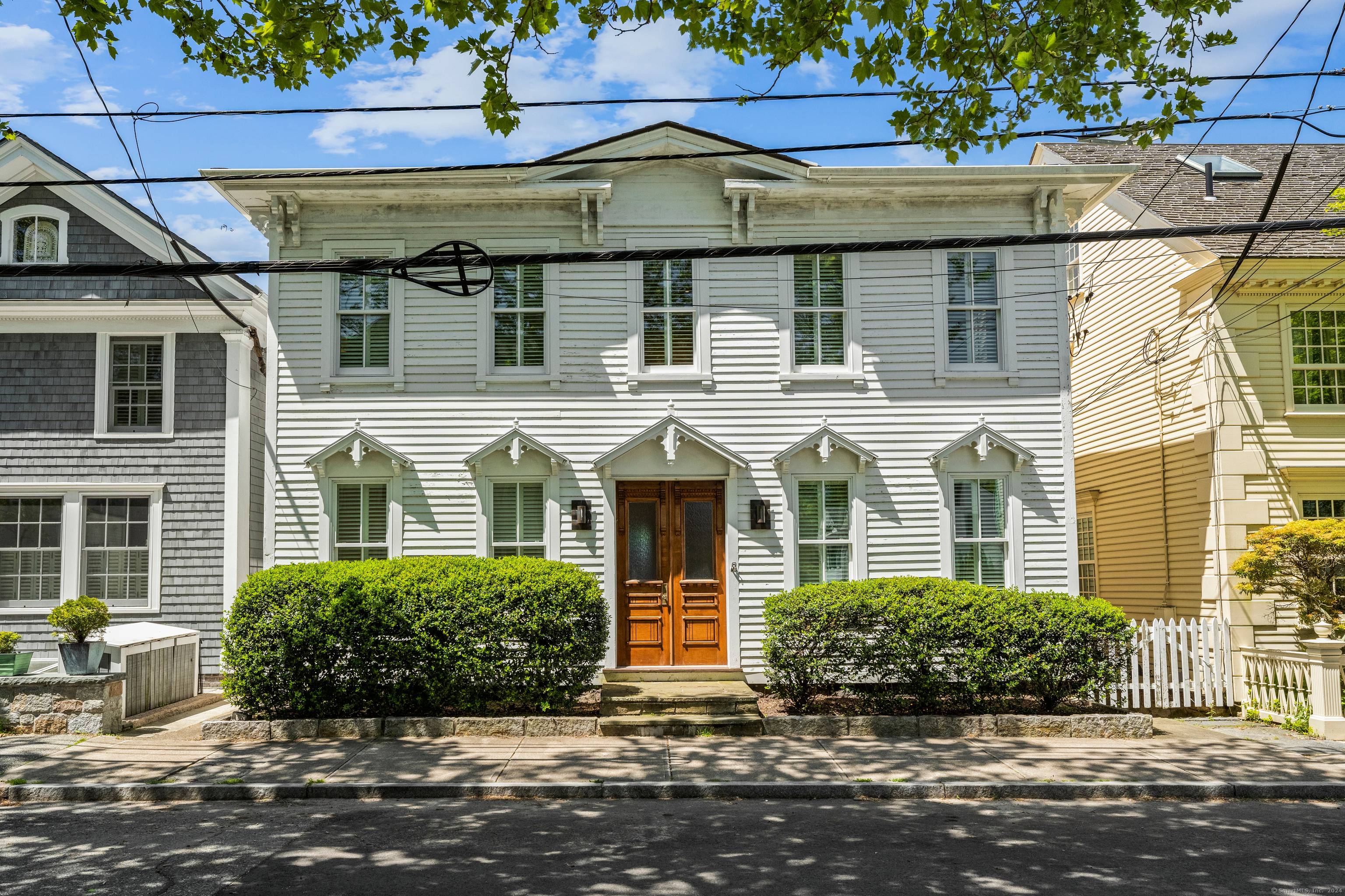 Exquisite waterfront property in the heart of the Stonington Borough with stunning unobstructed water views through the floor to ceiling windows and a private dock on Stonington Harbor.