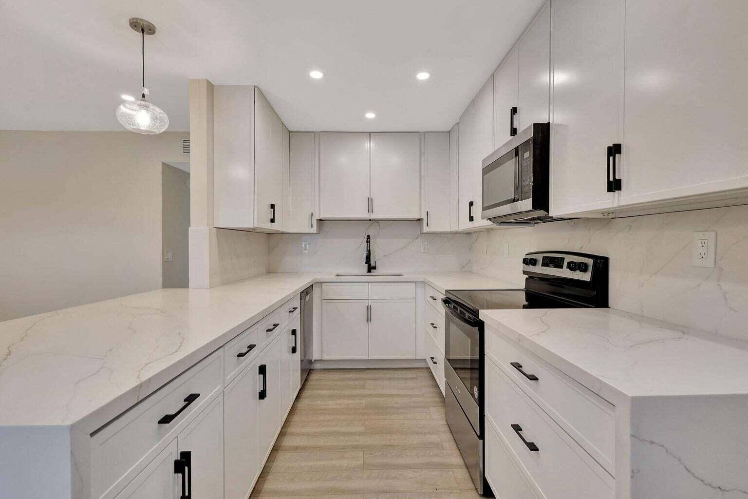 Discover the ultimate in luxury living at 802 Burgundy Q, a stunning 2nd floor designer condo located in the exclusive 55 community of Kings Point Golf Country Club.