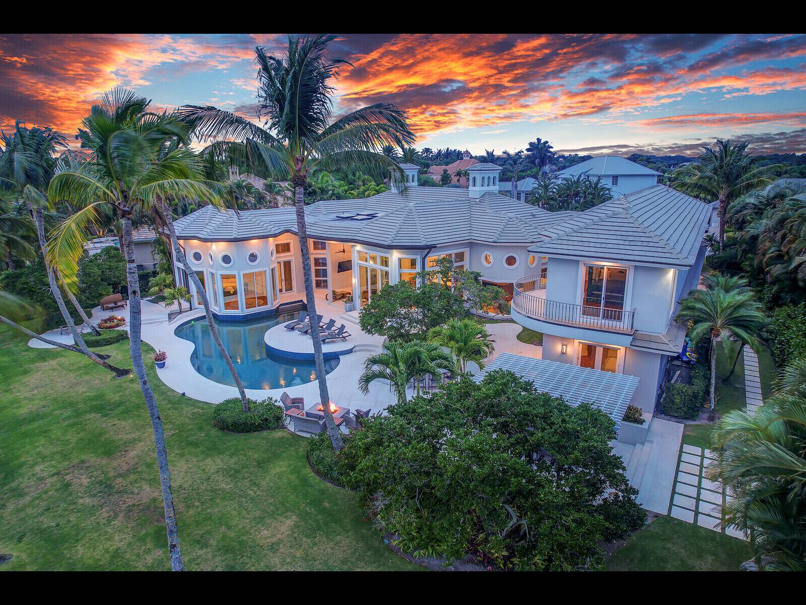 Welcome to a rare gem within the prestigious gates of Old Marsh Golf Club an extraordinary estate that redefines refined living across more than 7, 400 square feet.