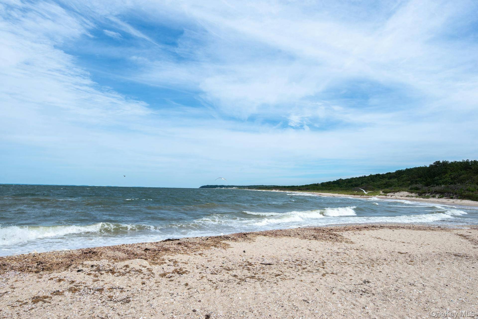 Build your dream home on this exceptional waterfront lot offering unobstructed, forever views and breathtaking sunsets over the pristine waters of the sound.