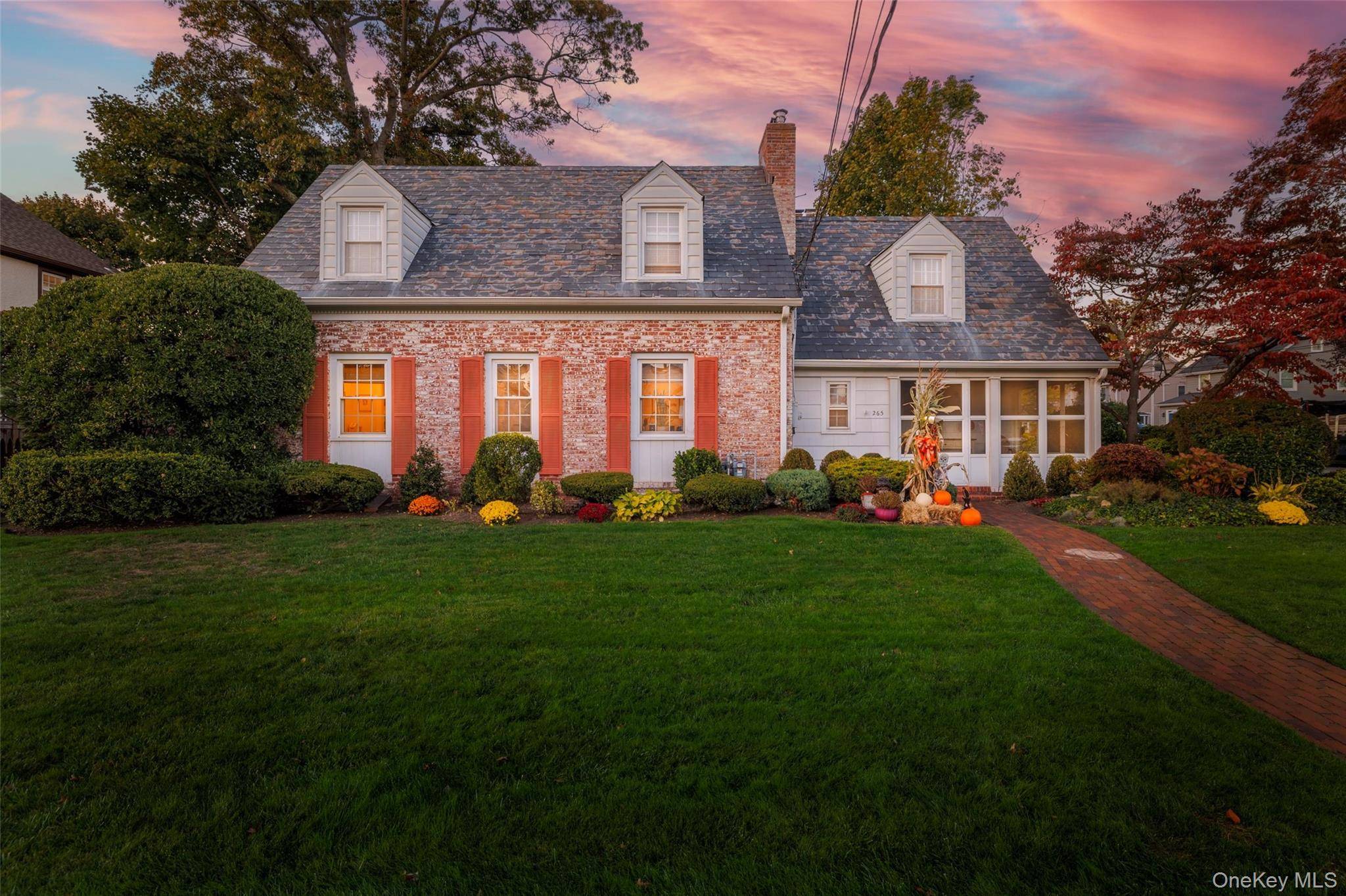 Charming White Washed Brick Cape located in the heart of Rockville Centre.