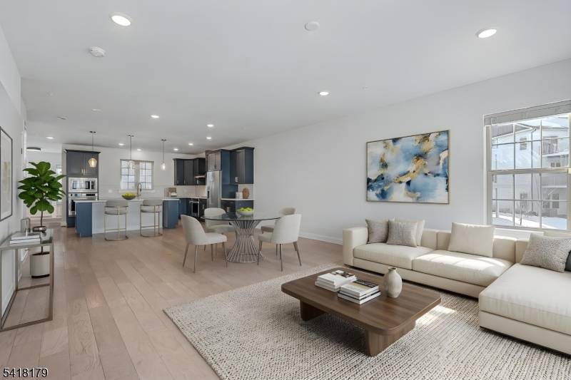 This exceptional end unit Isleton townhome provides three levels of stunning finished living space, with thoughtfully selected upgrades.
