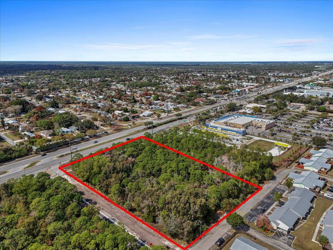 Prime 3. 77 acre commercial vacant lot located on highly trafficked Federal Highway, offering exceptional visibility and accessibility.