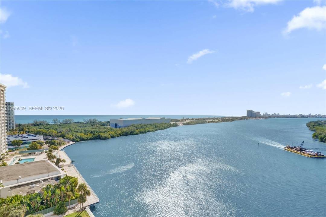 This stunning corner unit condo offers breathtaking, unobstructed views of both the ocean and bay, delivering sweeping water vistas from every room.