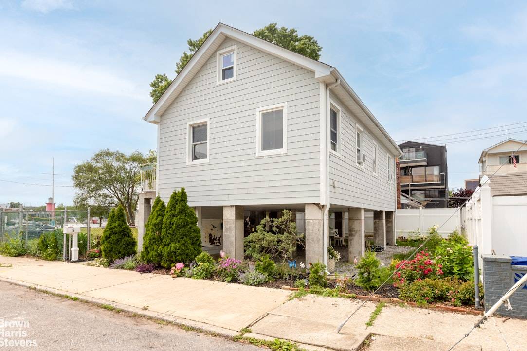Elevated Home on Double Lot Just One House Off the Waterfront in Gerritsen Beach Discover this bright and elevated single family home, ideally situated just one house off the waterfront ...