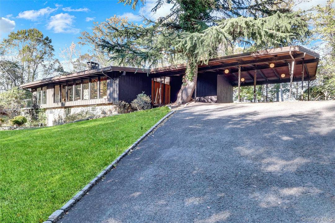Perched atop a scenic hill in one of Smithtown s most prestigious enclaves, this architecturally distinctive ranch style home offers an unmatched combination of total privacy, eco conscious design, and ...