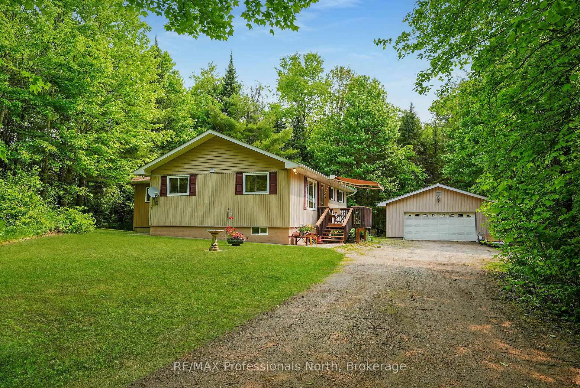 You will fall in love with this well maintained home, sitting on over 6 acres and nestled amongst the trees.