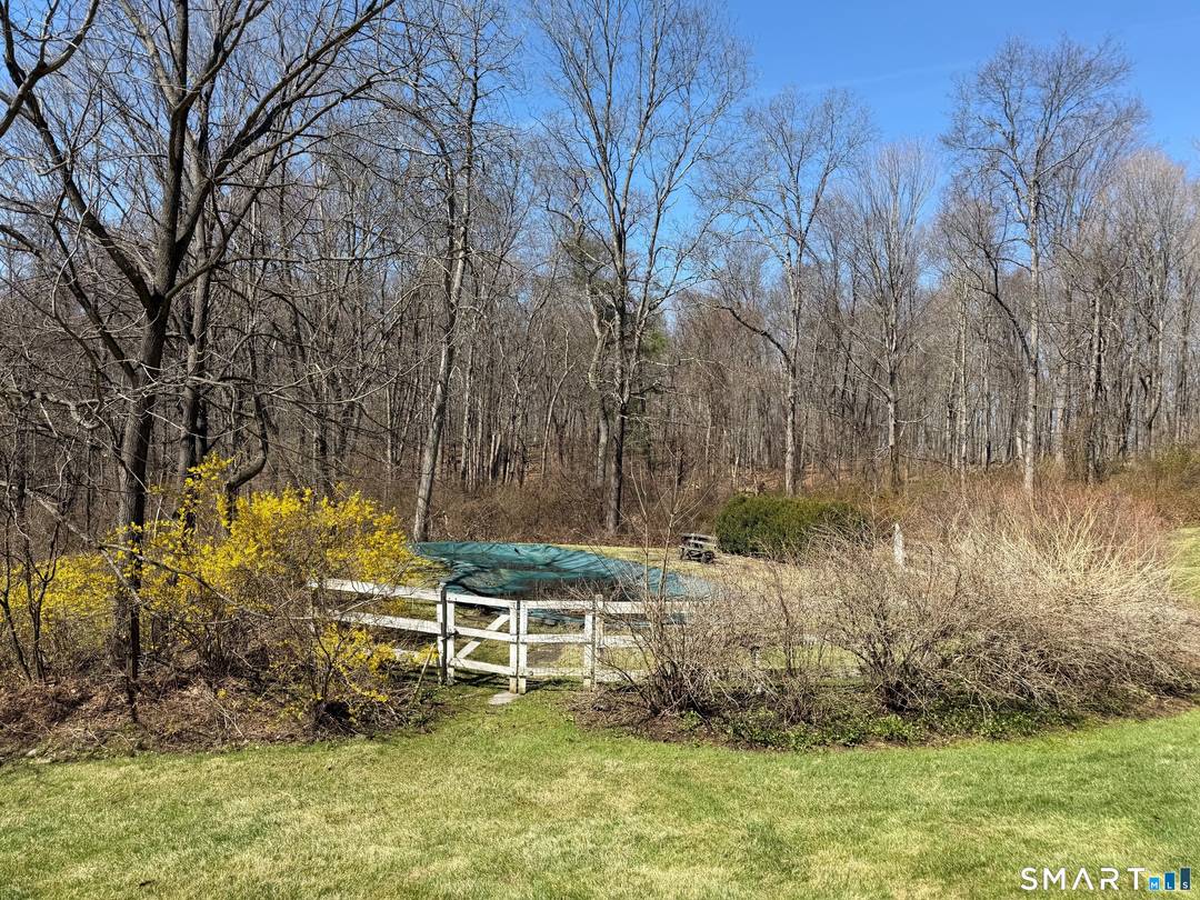 Rarely available. 1880 antique gem on 10 acres, with a first level primary bedroom and bath, situated on one of Bridgewater's most prestigious and quiet roads, offering a private setting.