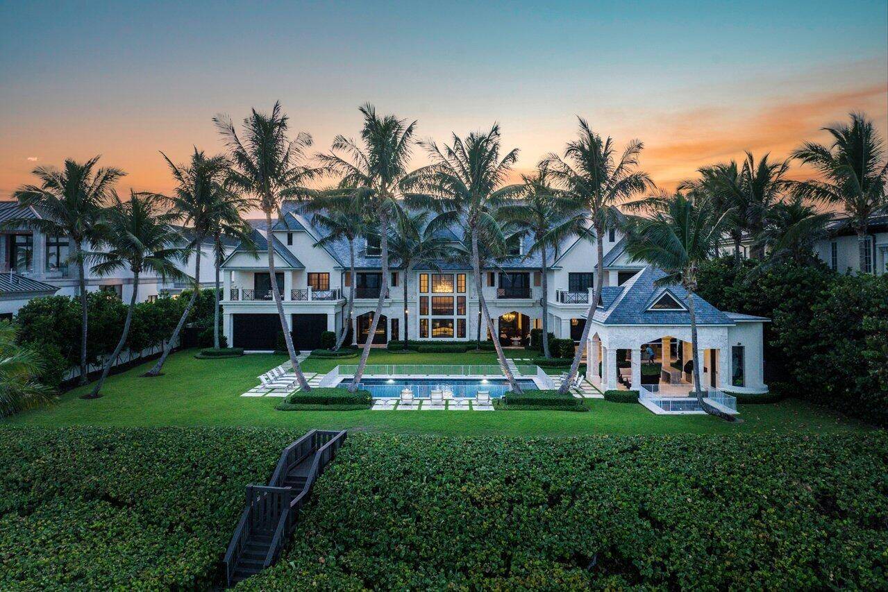 Sited on Highland Beach's largest oceanfront lot, this rarely available estate designed by Madey Architects is one of most prestigious homes in Palm Beach County.