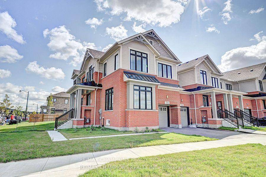 This fully upgraded end unit townhome sits on a massive corner lot.