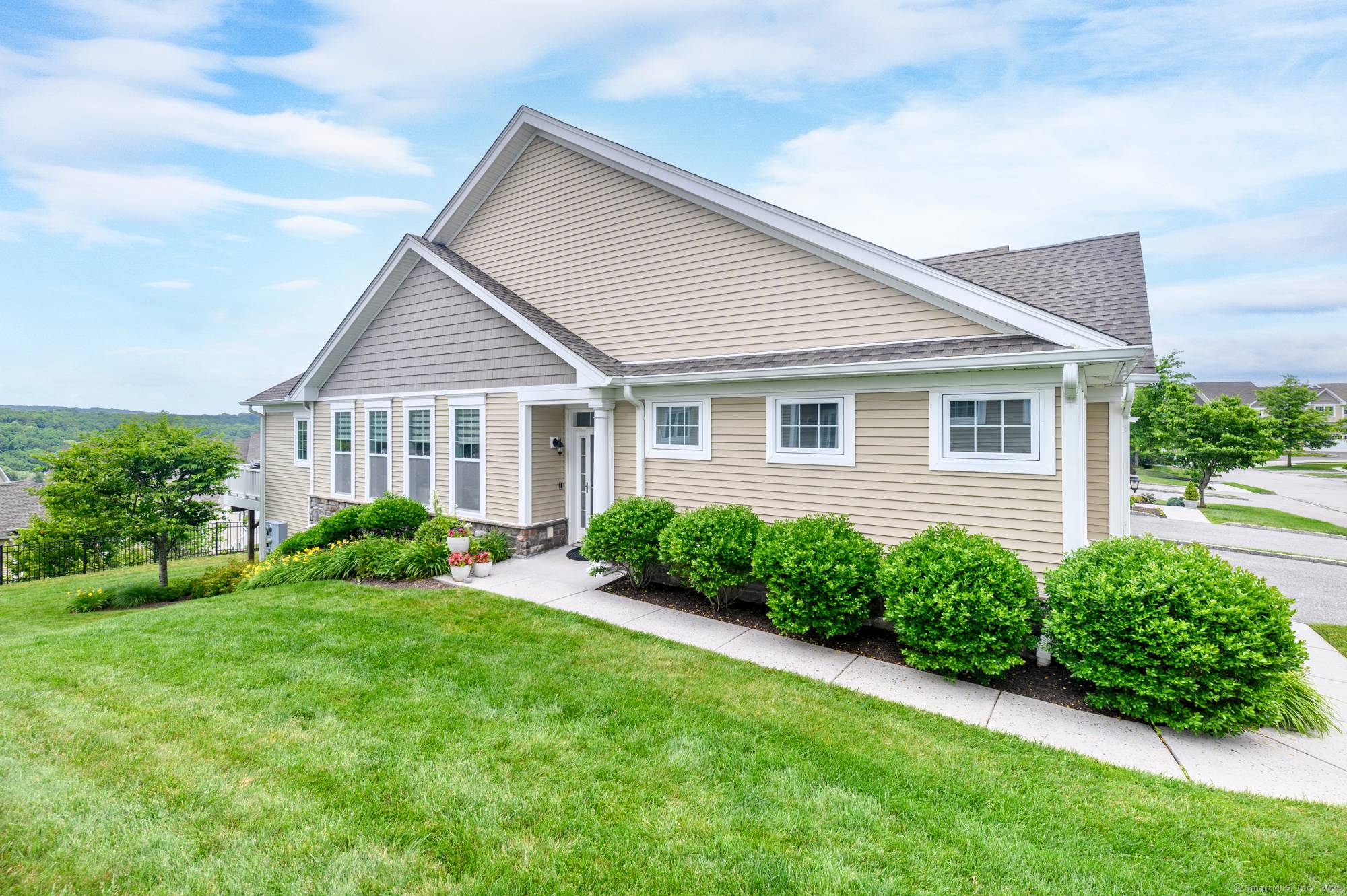 A rare and refined end unit in one of Danbury's most sought after communities, perfectly positioned to capture sweeping mountain views, the light of sunrises, and the gorgeous glow of ...