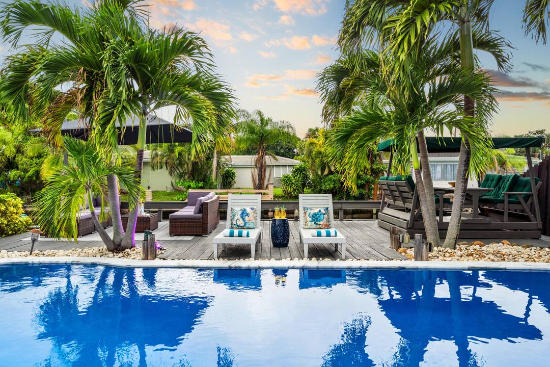 Welcome to your Island escape, a beautifully updated 4 bed 2 bath waterfront pool home designed for the ultimate South Florida lifestyle.