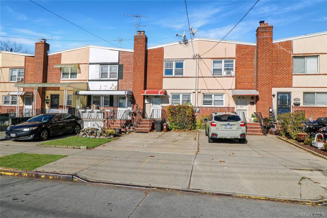 Welcome to this attached one family home situated in one of Bayside s most desirable neighborhoods.