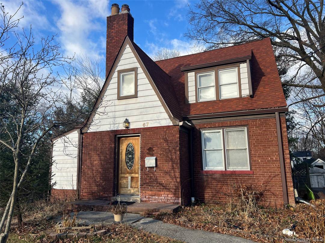 Unusual find Charming Tudor style brick home in residential neighborhood.