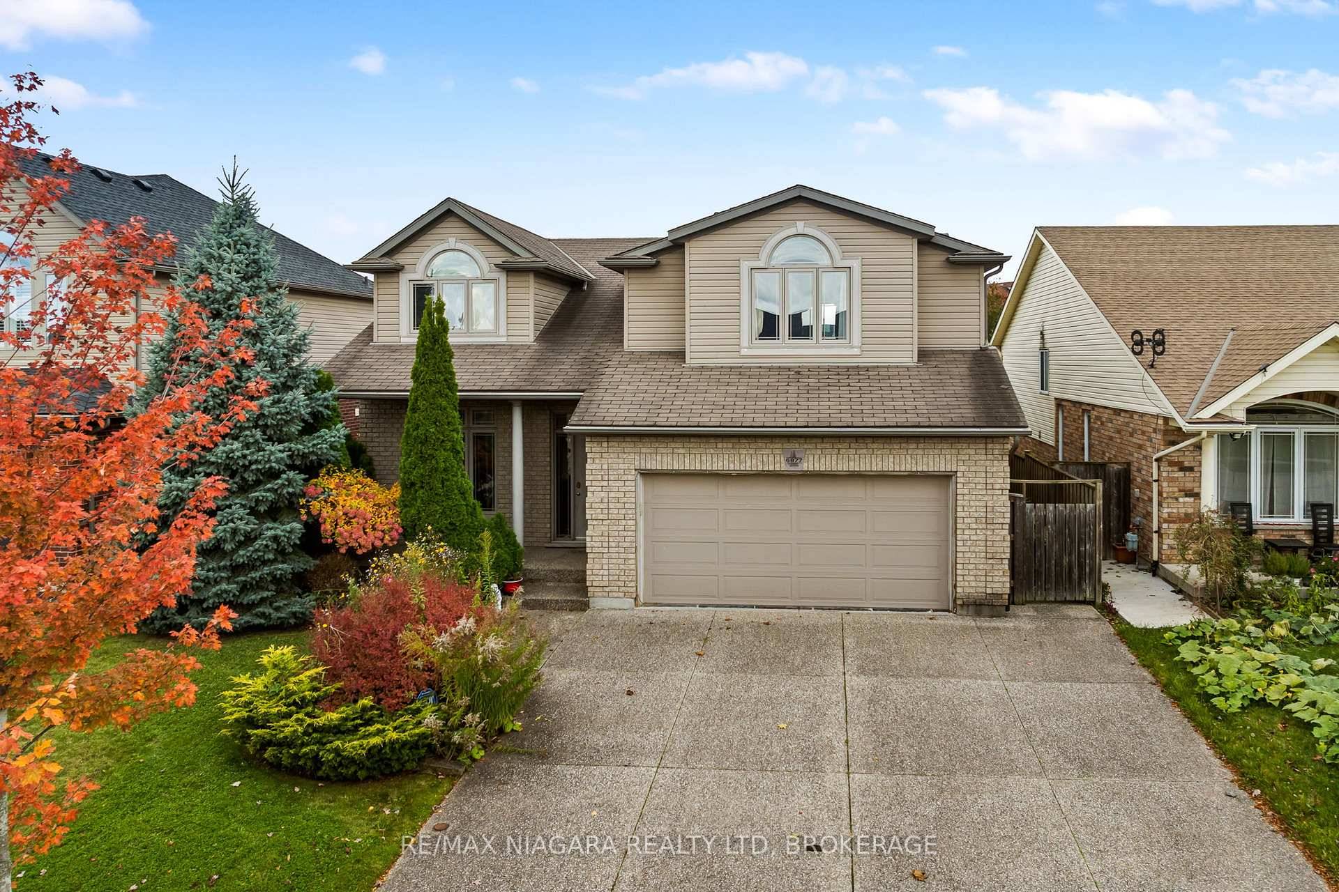 6877 Courtney Crescent, Niagara Falls a spacious and thoughtfully designed four level side split with 4 1 bedrooms and 4 full bathrooms, offering comfort, privacy, and flexibility for multi generational ...