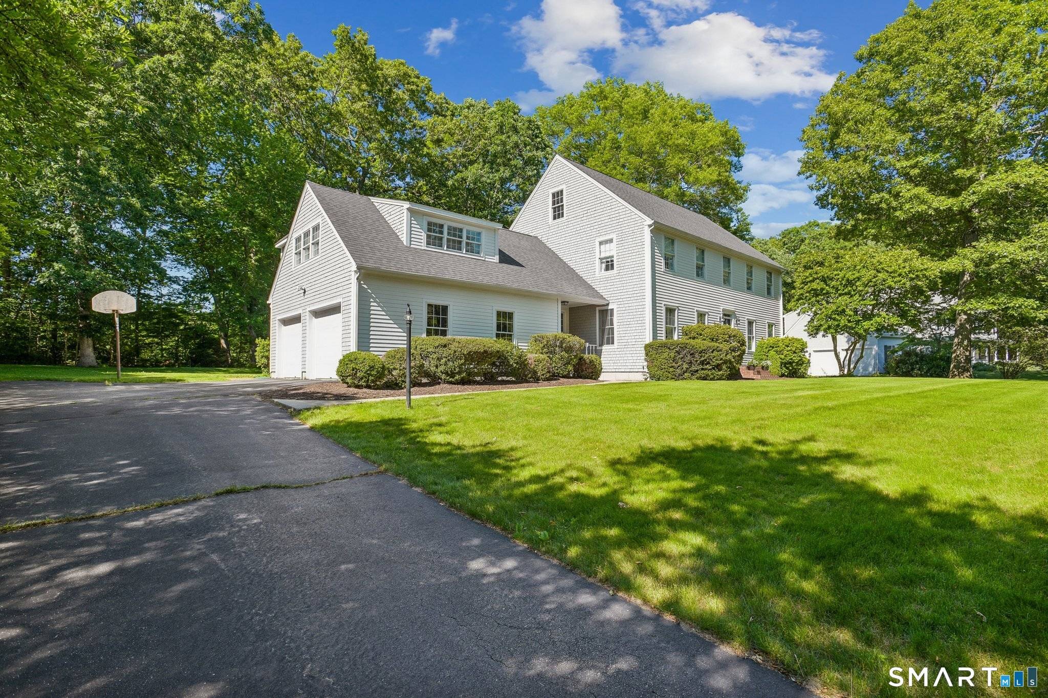 Discover this much admired, quintessential New England Colonial nestled on a manicured, acre lot.
