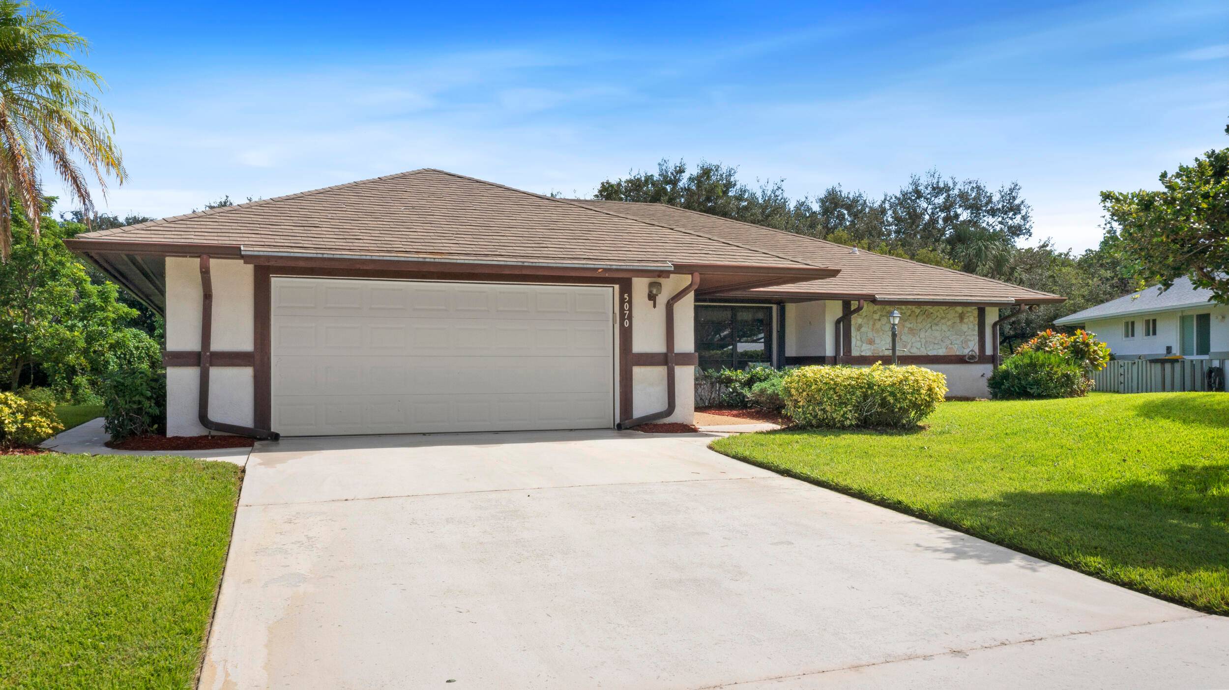 Charming CBS home in Country Club Cove, a quiet community of only 53 homes in Miles Grant.