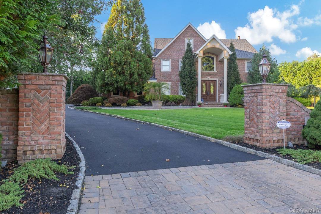 Discover refined living in this exquisite 4 bedroom, 3 1 2 bath luxury home located in the prestigious Old Neck Estates of Manorville.