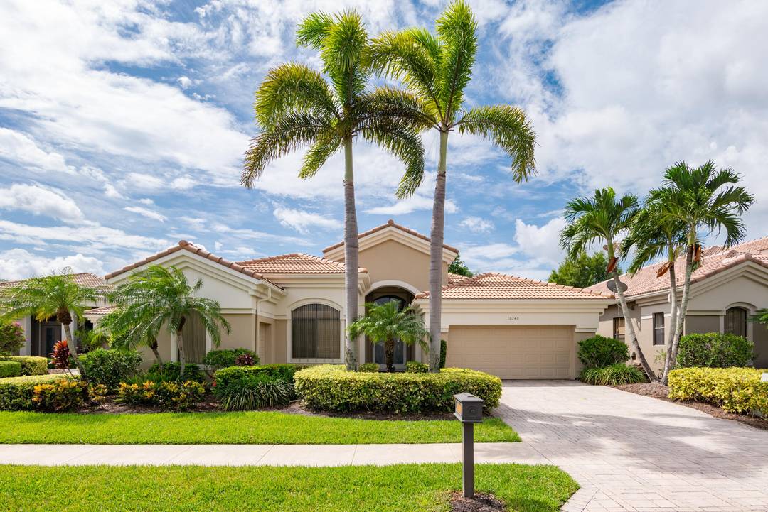 Updated pool home with 3BR 3BA plus Den with long lake and golf course views at The Club at Ibis in West Palm Beach.