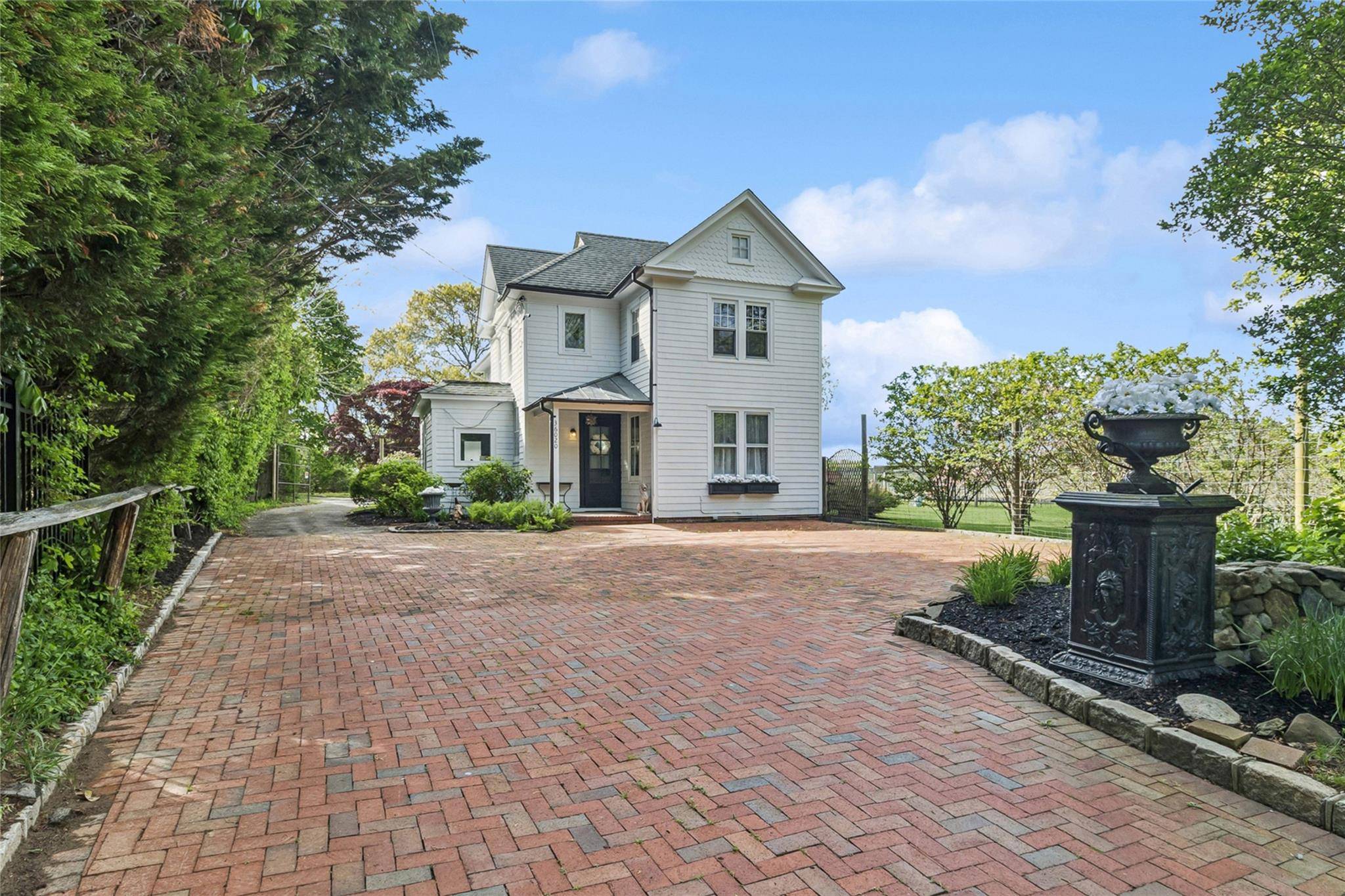 Enjoy this renovated Farm House circa 1899 on a treed level lot adjacent to a boutique vineyard.