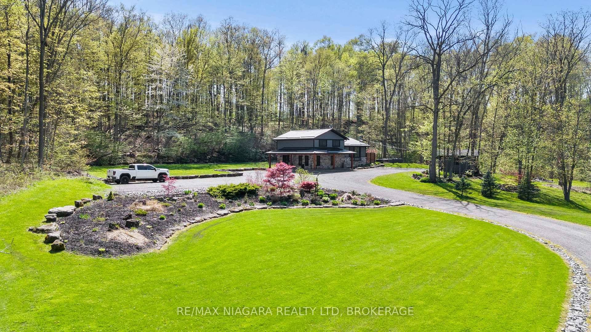 Tucked away on nearly 4 acres of pure seclusion, this beautifully updated 3 1 bedroom, 2 full bath split level home is surrounded by serene woods and features natural waterfalls ...