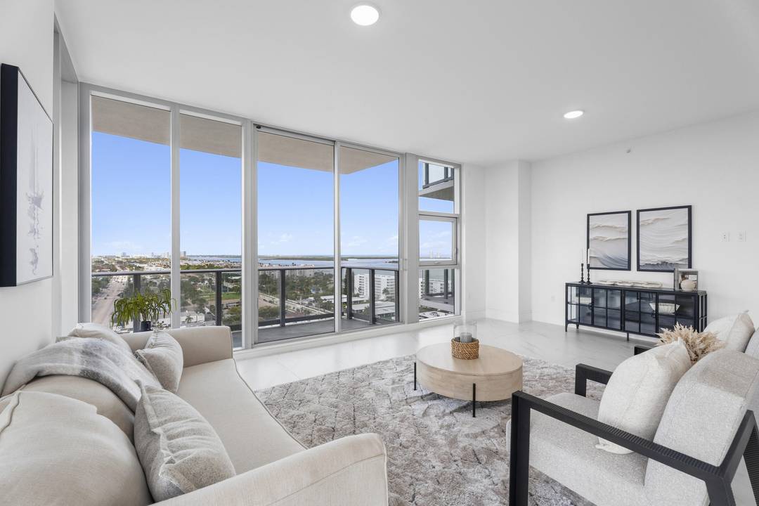 Rare Floorplan C residence at Nautilus 220 featuring expansive wraparound balconies and sweeping water views.