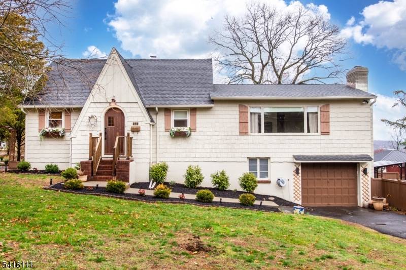 Welcome to this oversized Cape Cod perfectly situated on a large corner lot.