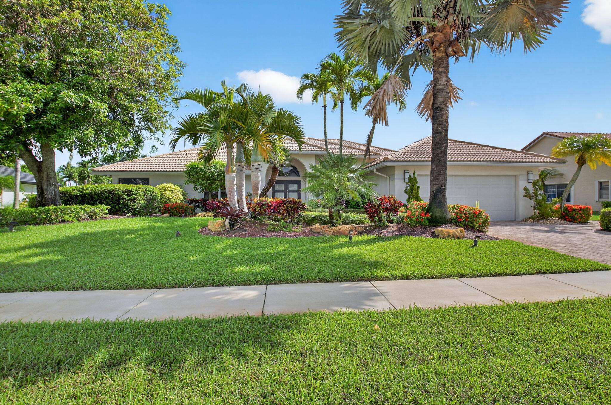 Welcome to 10791 River Glenn Dr, a stunning single family home in the heart of Boca Woods Country Club.