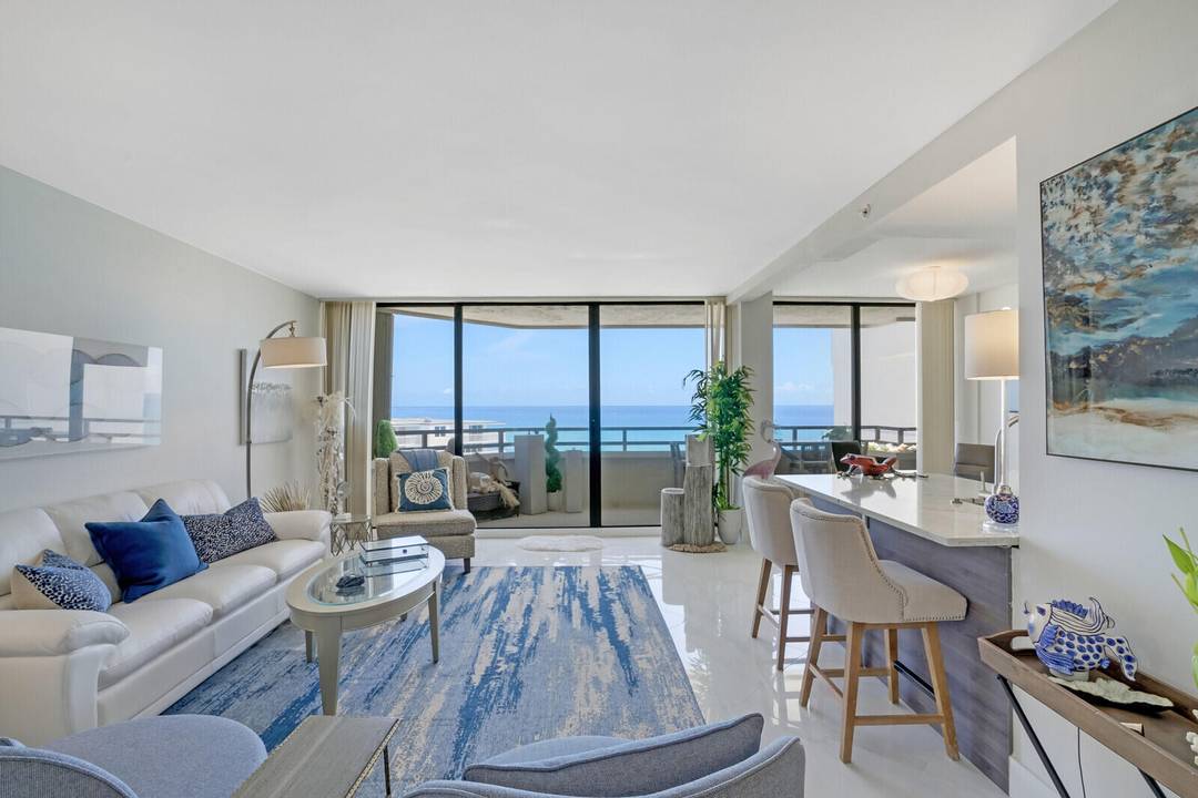 OCEAN VIEWS from every window, this vacation PENTHOUSE rental located on the sand offers idyllic, breathtaking ocean views, coastal contemporary finishes, covered parking, with amenities such as a gym, pool ...