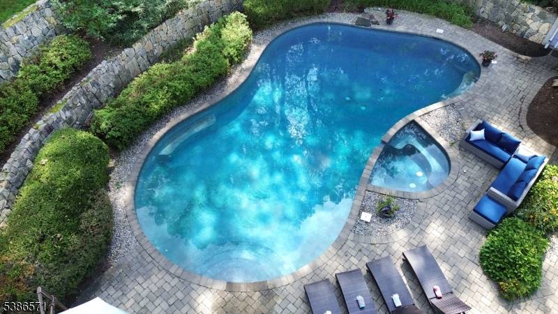 Perfection picturesquely set on over 5 acres nestled within Roxiticus Valley section of Mendham Twsp.