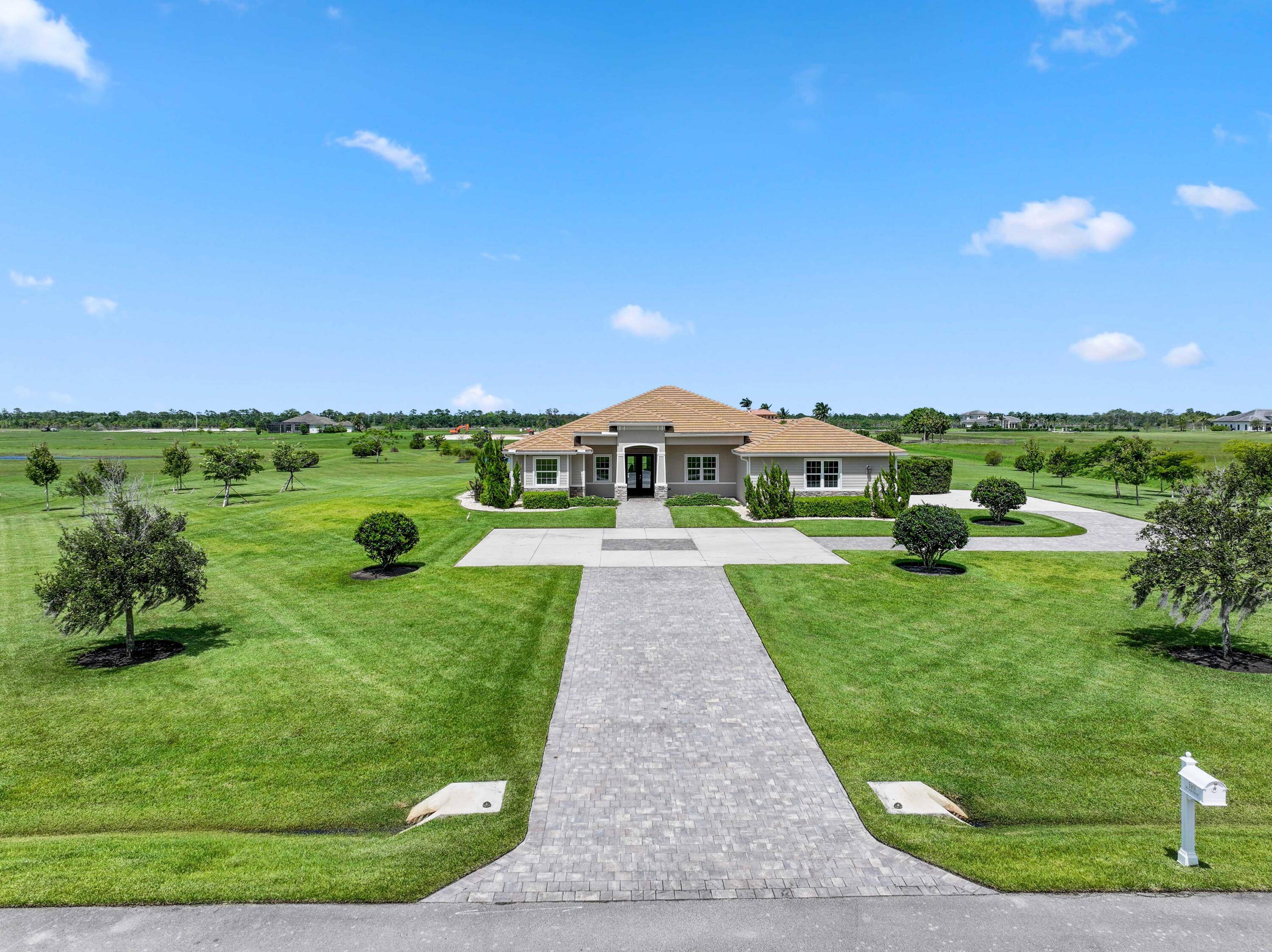 Welcome to estate living on 5 private acres in one of Martin County's most desirable neighborhoods.