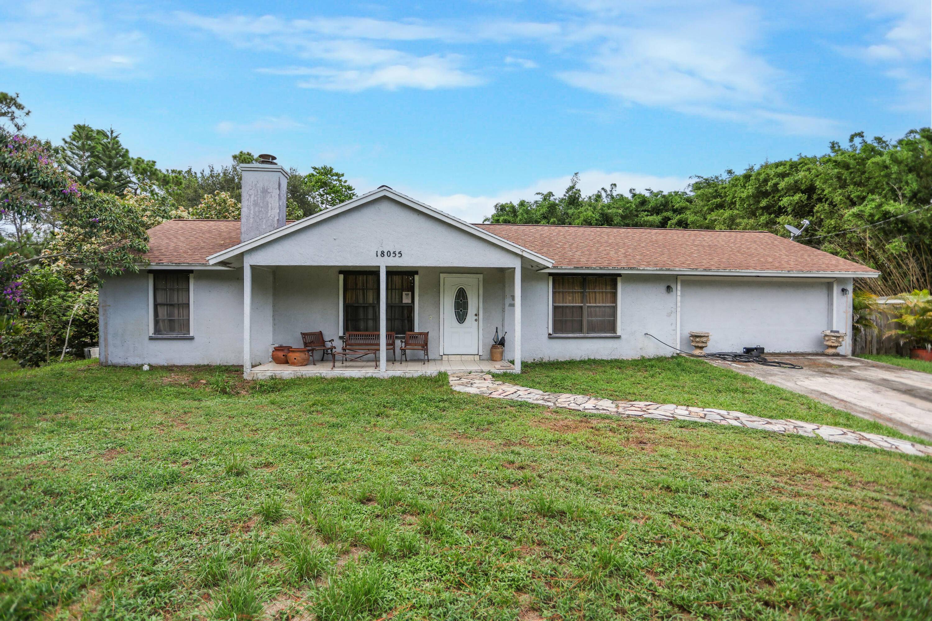 Welcome to 18055 W Sycamore Dr in beautiful Loxahatchee, just minutes from the growing community of Westlake !