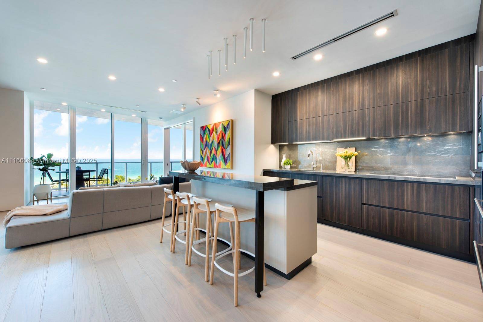 Influenced by the surrounding sand and ocean, this newly redesigned Continuum residence offers a unique open split floor plan and sweeping ocean views from every room.