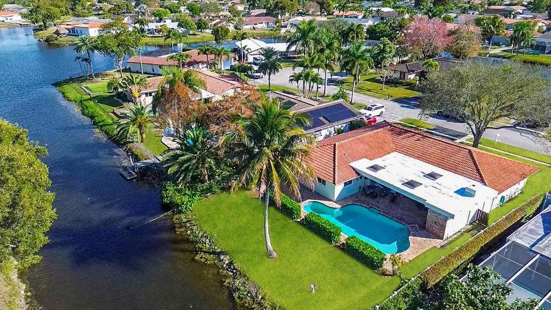 Welcome to this cozy waterfront home in a prime Coral Springs location, situated in a quiet, well established neighborhood with no HOA !