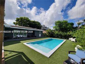 This beautifully maintained single story Mid Century Modern home offers over 2, 000 sq ft of living space in a classic Florida ranch style design.