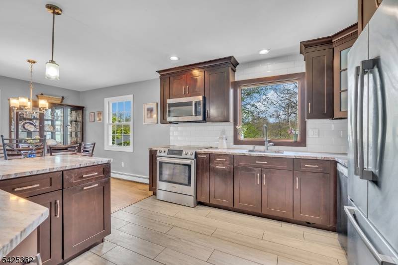 Welcome to this lovely spacious bi level home offering comfort, flexibility, and incredible potential in the heart of Packanack Lake.