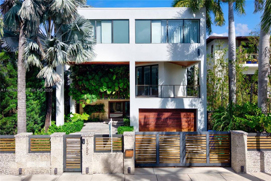 Set within Coconut Grove s exclusive Fairhaven Estates, this modern waterfront residence spans three levels and offers refined indoor outdoor living with peaceful water views and abundant natural light throughout.