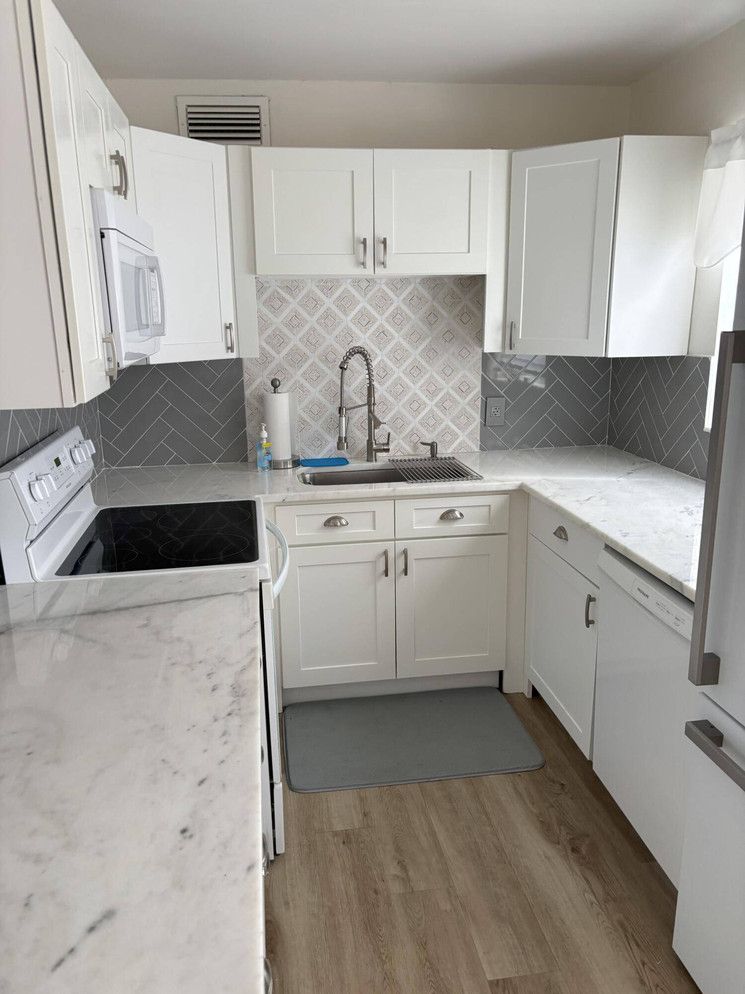 Don't miss this first floor corner unit in the very active adult community of Century Village.