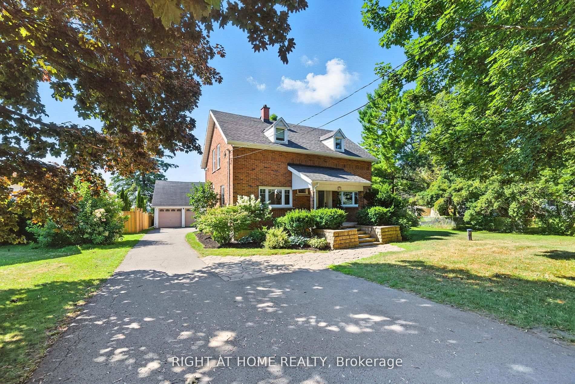 Private Country Living Renovated Home with Lake Ontario Views on Nearly 300 ft Lot.